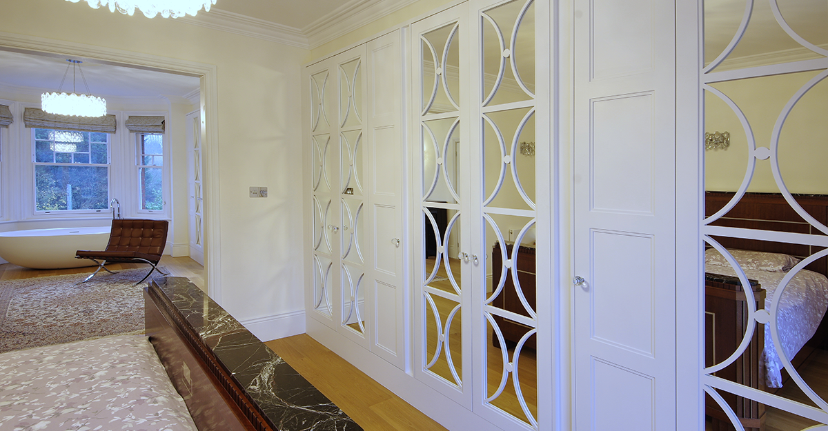 bespoke white hand painted fret work bedroom